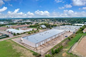 Birds eye view of all four buildingsin the Suffolk Business Park with views of downtown Fort Worth in the background